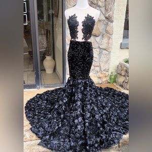 This black beautiful Custom Handmade dress is a show stopper at any event.